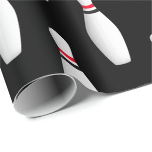 vitbowlingstift på svart presentpapper