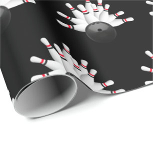 vitbowlingstift på svart presentpapper