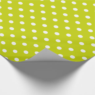 Vitpolka dots på limefruktgrönt presentpapper