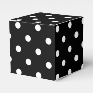 Vitpolka dots som är medel på svart presentaskar