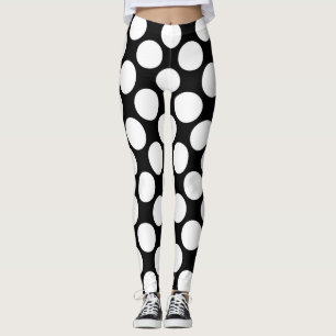 Vitpolka dots som är stor på svart leggings