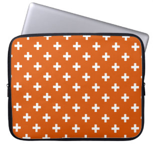 Vitpolka kor på bränd orange laptop fodral