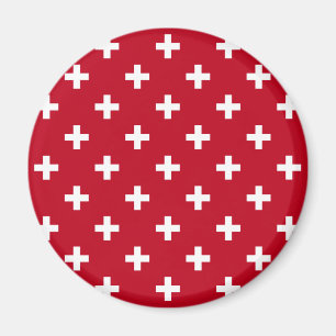 Vitpolka kor på rött magnet