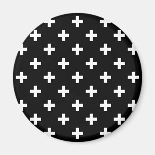 Vitpolka kor på svart magnet