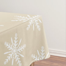 Vitsnöflingor på beige julaftontablecloth.