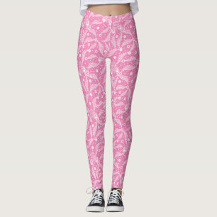 Vitt blomsterbroderi på rosa bakgrund leggings