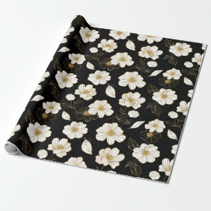 Vitt guld blommor på svart presentpapper
