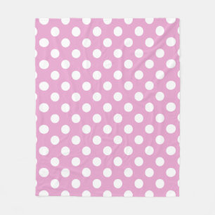 Vitt polka dots om blekens rosa fleecefilt