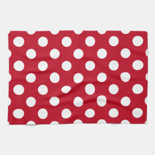Vitt polka dots på rött kökshandduk