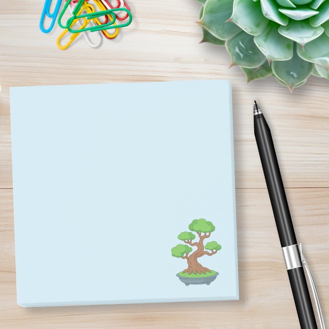 Vriden japansk bonsaiträd på blå post-it block (Skapare uppladdad)