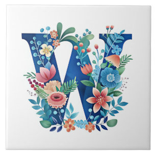 W ornat blommigt monogram kakelplatta