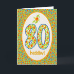 Walesiskt 80th födelsedagkort, orange kort<br><div class="desc">Ett nätt 80th födelsedagkort,  med hälsningen i walesiskt och ett mönster av ljusa orange krukaringblommar i gränsen såväl som i numrerar. Från räcka-målat motiv av Judy Adamson.</div>
