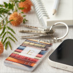 Watercolor Bookstack Reading Lover Monogram<br><div class="desc">A charming book‑lover keychain featuring a colourful stack of illustrated book spines and a personalized monogram framed in a classic, literary style. Perfect for readers who want to carry a little piece of their bookish world wherever they go, this custom keychain adds warmth and personality to bags, keys, backpacks, and...</div>