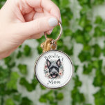 Watercolor Scottie och Blommigt Wand Rund Silverfärgad Nyckelring<br><div class="desc">Anpassa en charmerande nyckelring för familj eller vänner med en skotsk terrier med den här Watercolor Scottie och Blommigt Wandeans Keychain. Nyckelkedjedesignen har en söt leende skotsk ansikte och vattenfärgsutandning för blommigt och en charmerande typografisk textplacering för att lägga till marionettens namn. Perfekt för Scottie Mammor. Ytterligare presentartiklar tillgängliga med...</div>