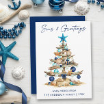 Watercolor Tree Beach Seas and Greetings Blue Julkort<br><div class="desc">Modern Minimalist Elegance Calligraphy Ink Pen Handwritten Script Seas & Greetings Coastal Holiday Card includes a Watercolor Christmas Tree make of beach ocean driftwood,  seashells,  sand dollars,  nautical anchor ornament and topped with a starfish. Navy Blue Back.</div>
