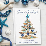 Watercolor Tree Seas and Greetings Beach Julkort<br><div class="desc">Modern Minimalist Elegance Calligraphy Ink Pen Handwritten Script Seas & Greetings Coastal Holiday Card includes a Watercolor Christmas Tree make of beach ocean driftwood,  seashells,  sand dollars,  nautical anchor ornament and topped with a starfish. Navy Blue Text.</div>