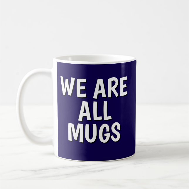 "We Are All Mugs” Mug – Cheeky Ceramic  Dark Blue Kaffemugg (Vänster)