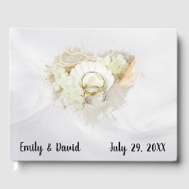 Wedding Rings in Seashell On White Satin Gästböcker