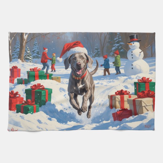 Weimaraner springer i snö med julhatt kökshandduk (Horisontell)