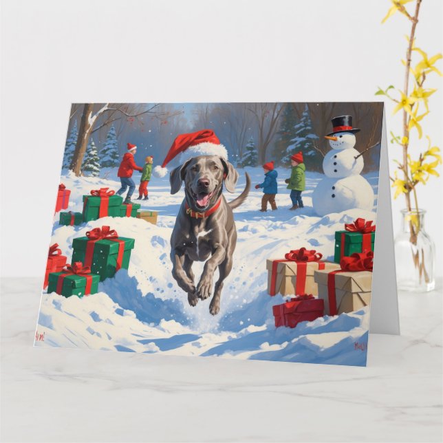 Weimaraner springer i snö med julhatt kort (Gul blomma)