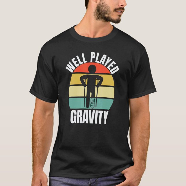 Well Played Gravity  Leg Fracture T Shirt (Framsida)