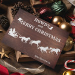 Western Cowboy Santa Sled Horse Helgdag Julkort<br><div class="desc">Den här designen skapades genom digital grafik. Den kan vara personlig i det område som tillhandahålls genom att ändra fotot och/eller text. Du kan också anpassa den genom att klicka för att anpassa ytterligare alternativ och ta bort eller ändra bakgrunden i färg, lägga till text, ändra texten färg eller stil...</div>