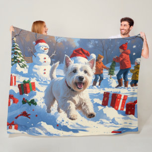 Westie springer i snö med julhatt fleecefilt