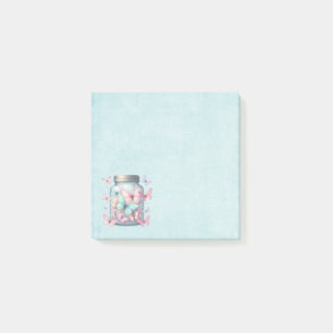 Whimsical fjäril i en burk post-it block