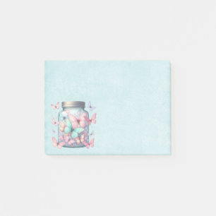 Whimsical fjärilar i en burk post-it block