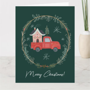 Whimsical röd jul-lastbil med mysigt hus kort