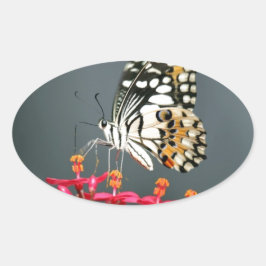 White Black and Gult Butterfly on Rosa Flowers Ovalt Klistermärke