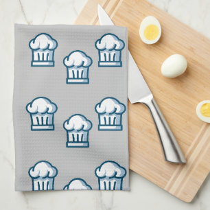 White chef hats on grey kökshandduk