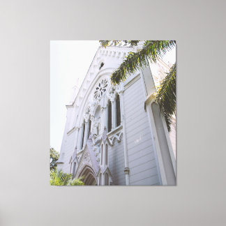 White Neo Gothic Church Facade Framed by Palm Tree Canvastryck