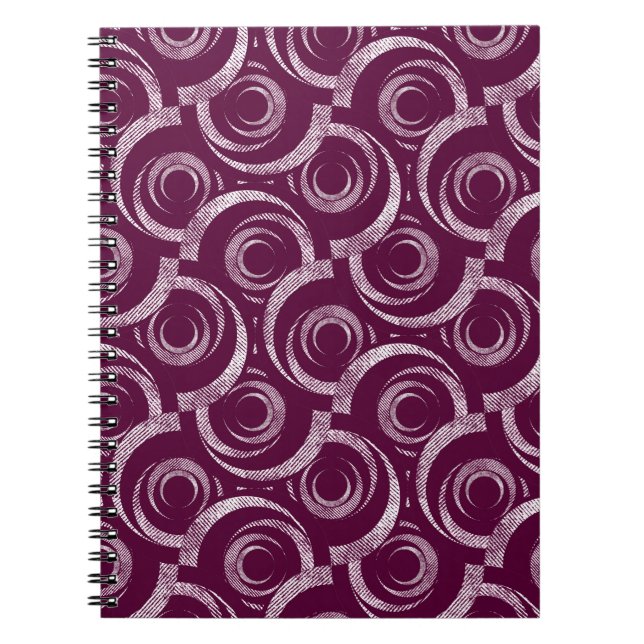 White ornament on a burgundy background. anteckningsbok (Framsidan)