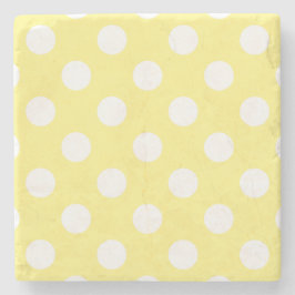 White polka dots om citrongulten stenunderlägg