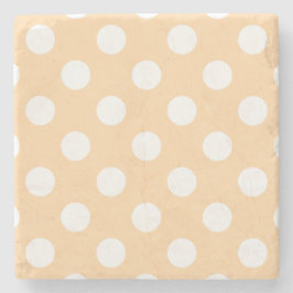 White polka dots på beige stenunderlägg