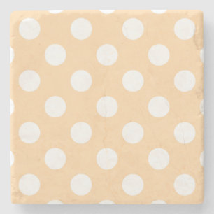 White polka dots på beige stenunderlägg