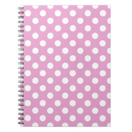 White polka dots på blekens rosa anteckningsbok med spiral