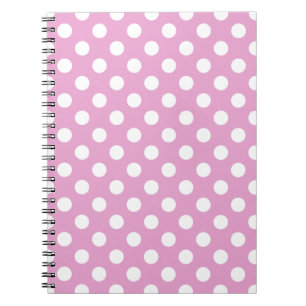 White polka dots på blekens rosa anteckningsbok med spiral