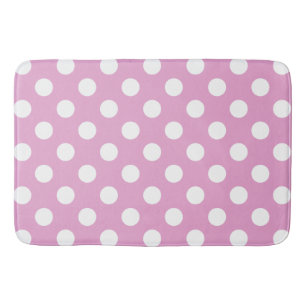 White polka dots på blekens rosa badrumsmatta