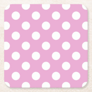 White polka dots på blekens rosa underlägg papper kvadrat