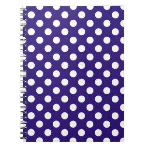 White polka dots på mörk blått anteckningsbok med spiral
