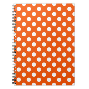 White polka dots på orange anteckningsbok med spiral