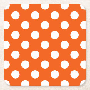 White polka dots på orange underlägg papper kvadrat