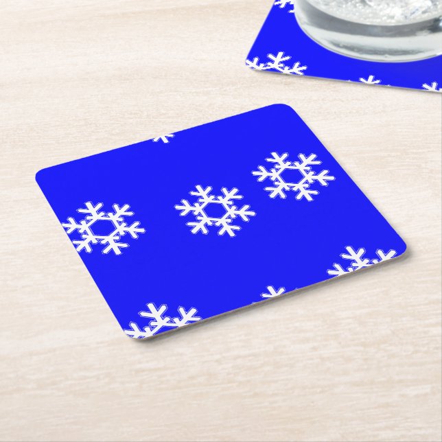 White snöflingor på blue underlägg papper kvadrat (Vinklad)