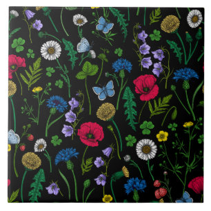 Wildblommor på svart kakelplatta
