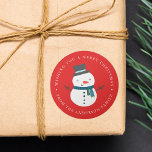 Winter Friends | SNÖGUBBE HELGDAG Runt Klistermärke<br><div class="desc">Lägg till en unik beröring i dina helgdag med våra Winter Friends-helgdag. De festliga klistermärkena har en söt,  tecknad snowflake med top hat och scarf med anpassningsbar hälsning och familjens namn som gränsar till klistermärket mot en röd bakgrund.</div>