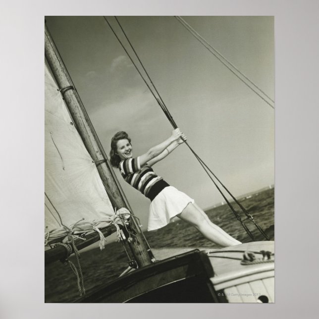 Woman Holding Rigging on Yacht Poster (Framsidan)