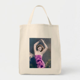 woman in purple sarong , arms raised as if dancing tygkasse