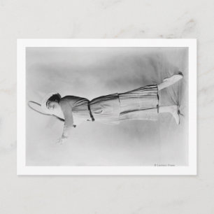 Woman Swinging Tennis Raquet Vykort